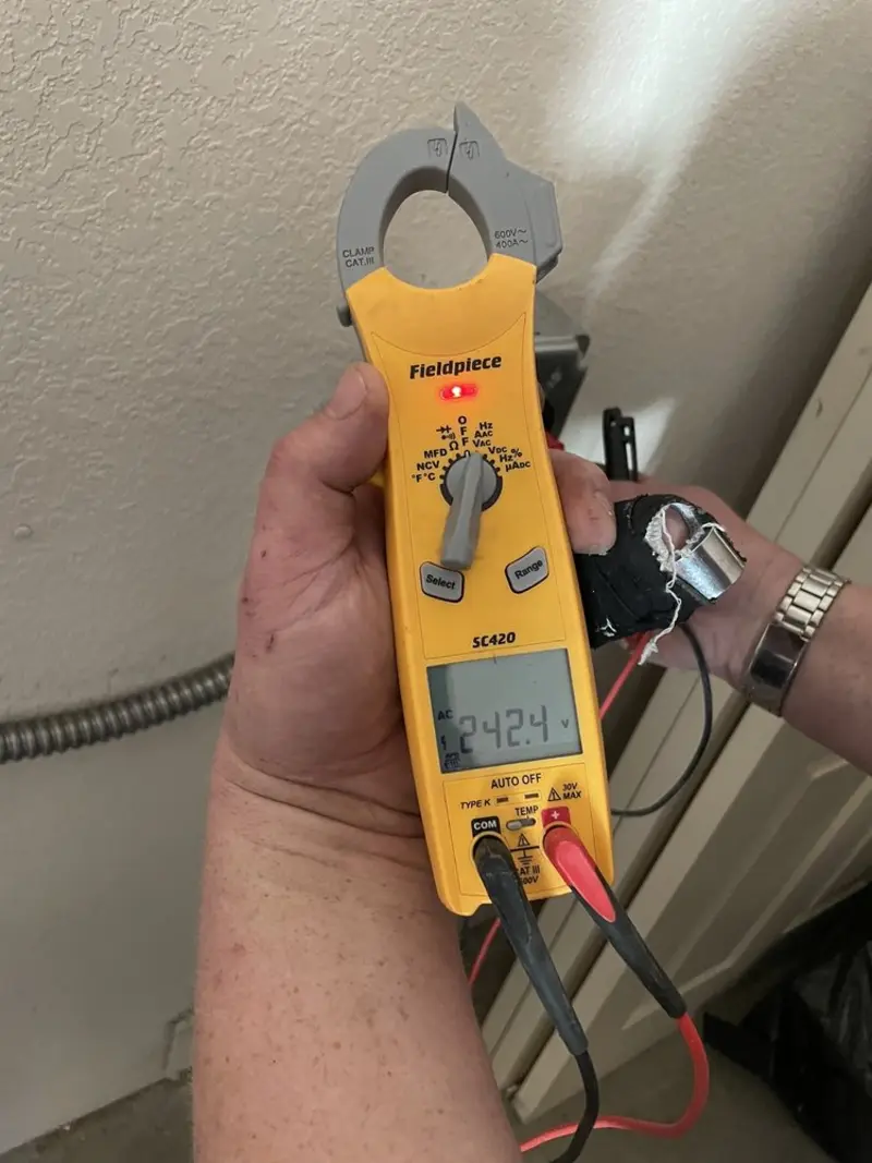 Voltage testing with clamp meter during Electrical Installation Services in Schertz